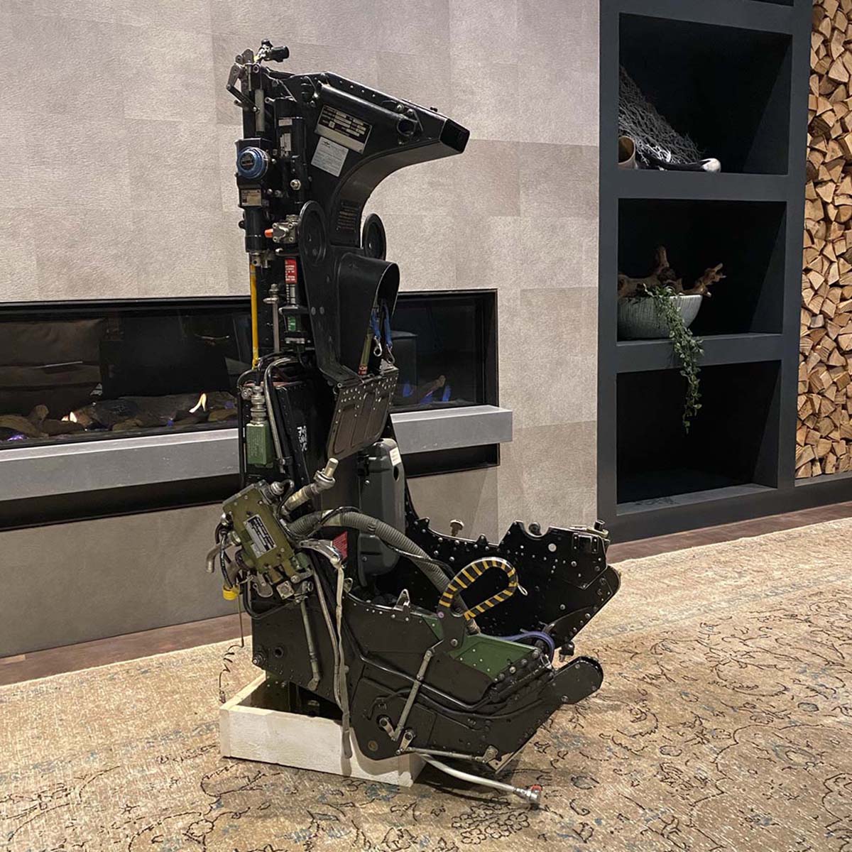 For sale: Martin Baker ejection seat in front of a fireplace.