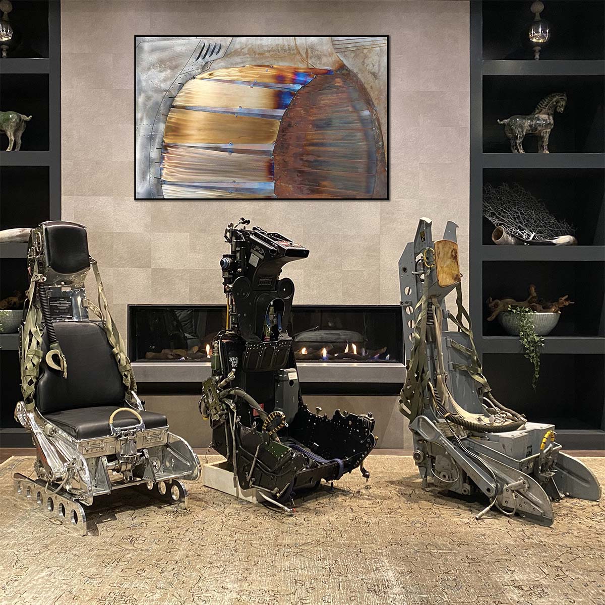 Three ejection seats and our steel aviation artwork.