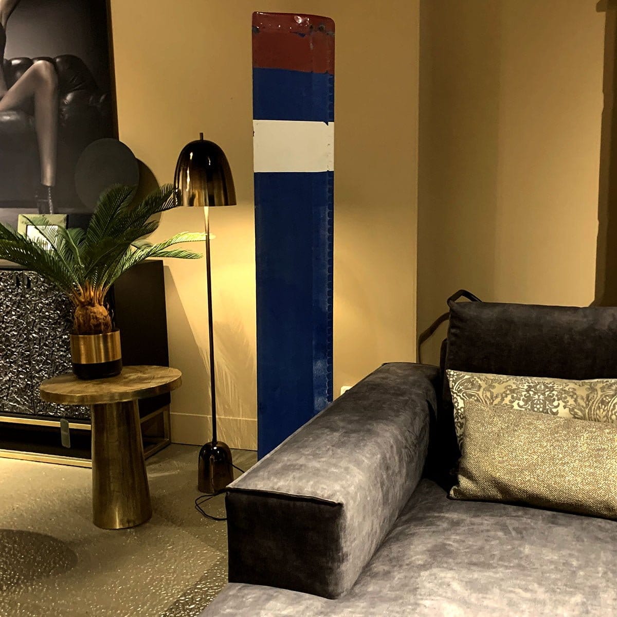 Blue Mil Mi-8 helicopter rotor next to a couch.