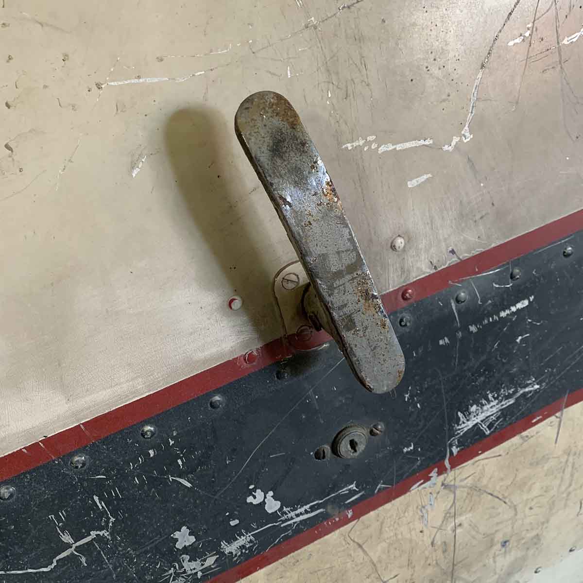 The handle of an original Douglas DC-3 Dakota passenger door.