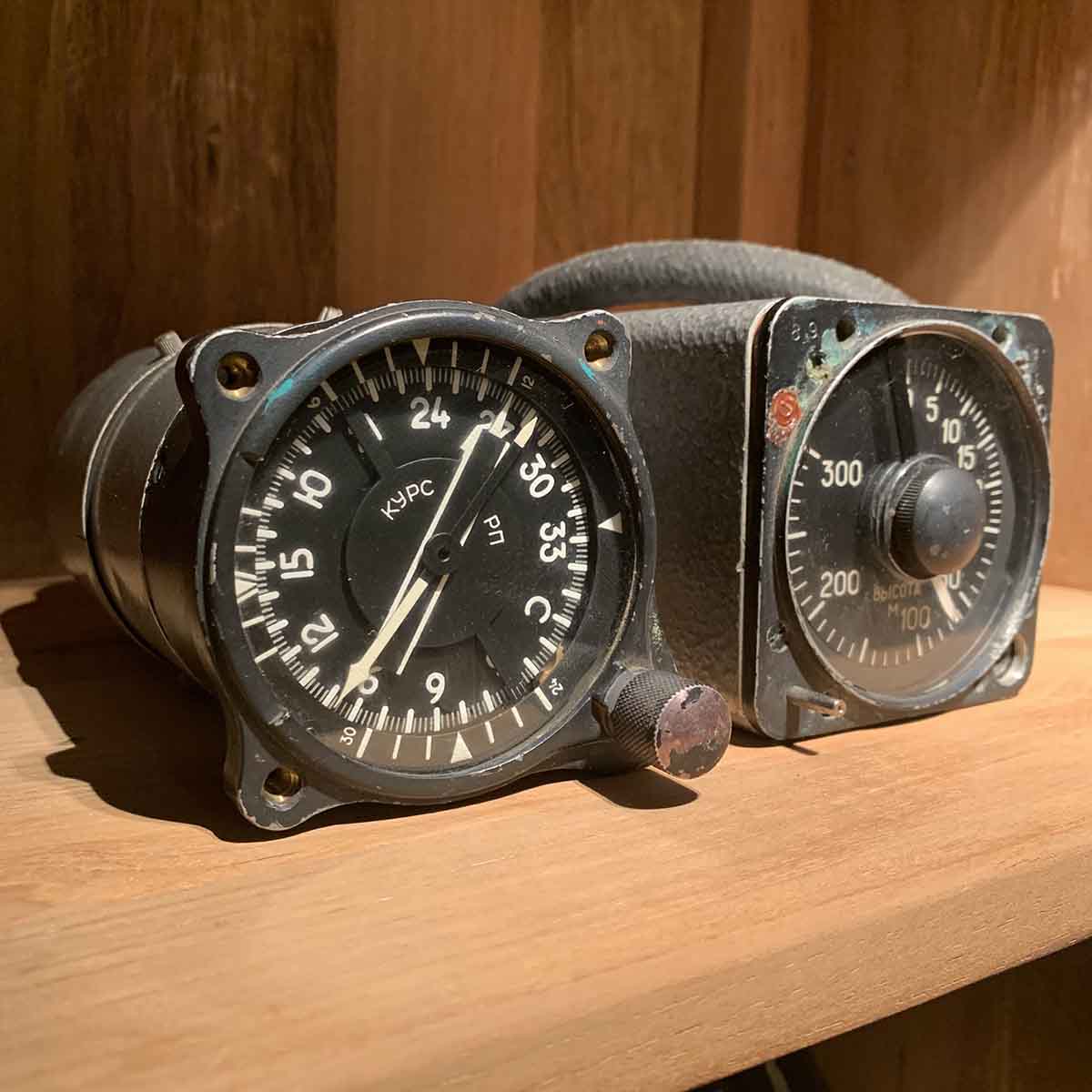 Russian military cockpit instruments in a cabinet.