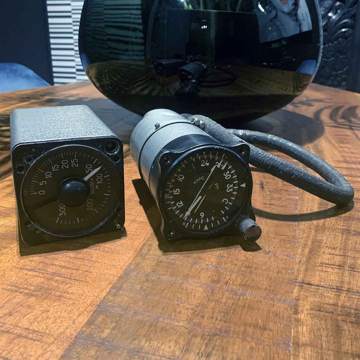 Russian military cockpit instruments on a table.