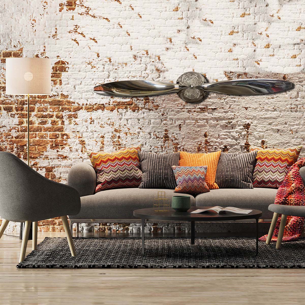 Mirror polished Hartzell propeller and spinner mounted on a wall in an living room.