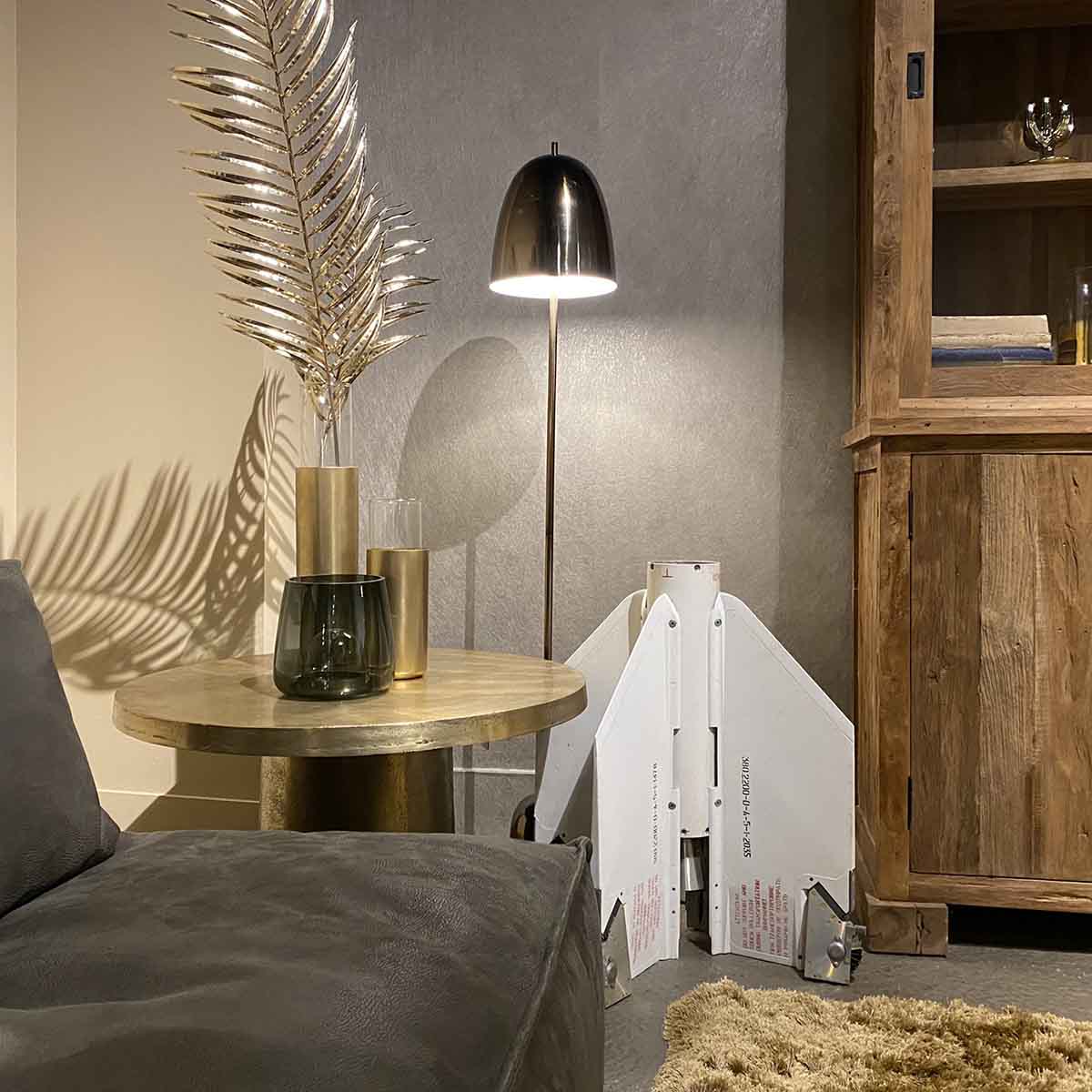 Back side of Vympel K-13 missile as a decorative piece in the corner of a room.