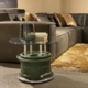 Side table made of main landing wheel of a MiG-29 Fulcrum positioned in a modern living room.