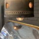 Rolls Royce Olympus combustion chamber light reflecting on DC-9 cargo door.