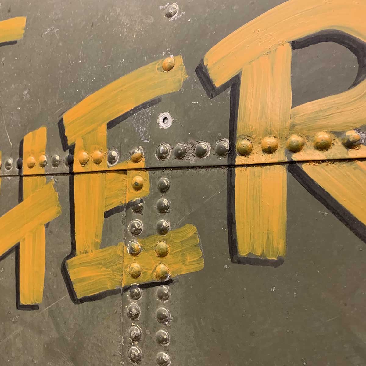 Detail of original C-47 Dakota skin panel painted with That's all Brother nose art.