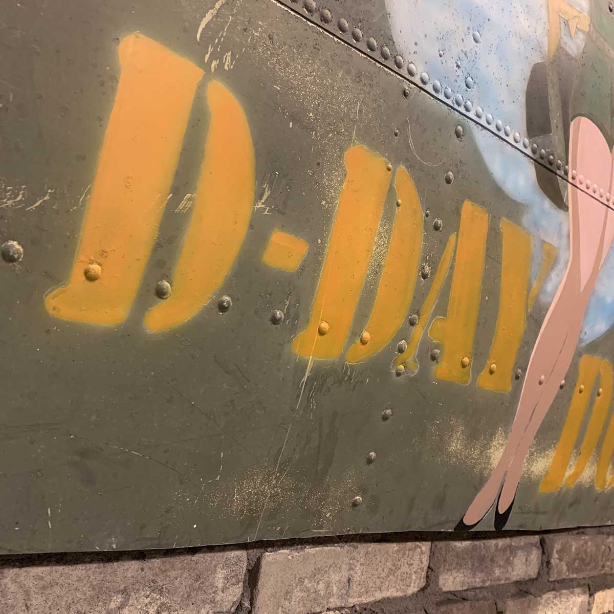 Detail of original C-47 Dakota skin panel painted with nose art.
