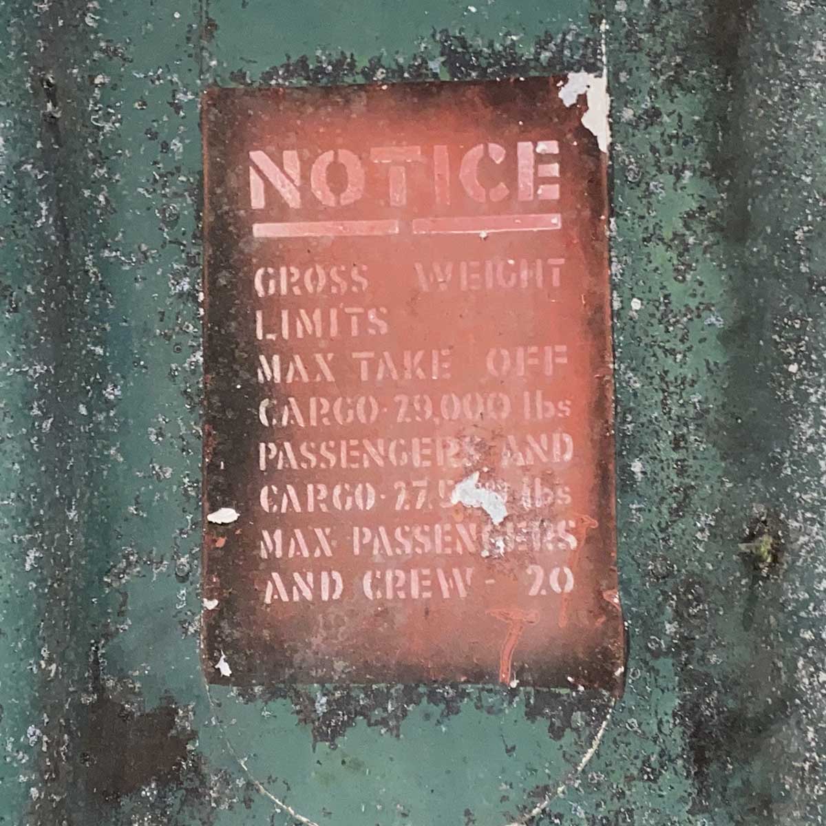 Detail of text on a United States military C-47 cargo door.