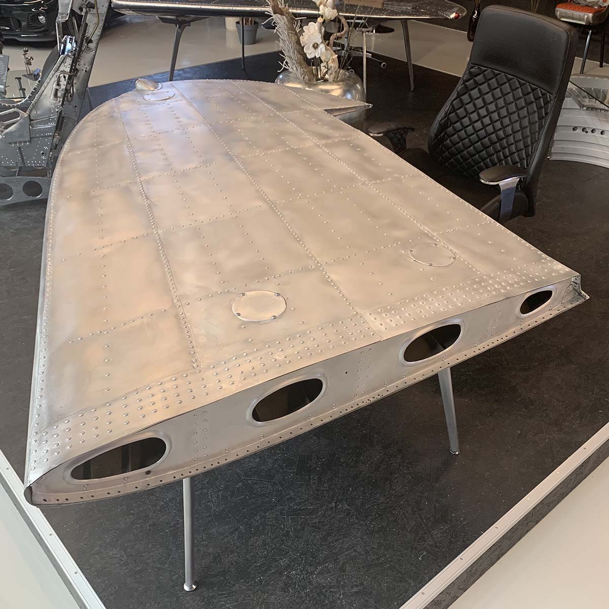 Overview of a Douglas DC-3 Dakota wingtip with matte finish and converted into a table for sale.