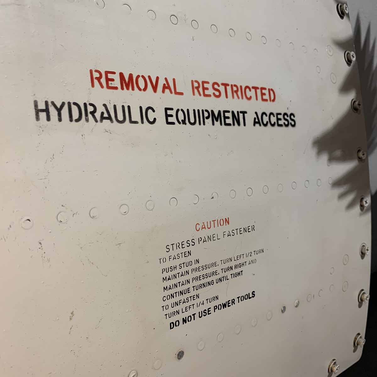 Detail of instructions on access panel of a Vought F-8 Crusader.