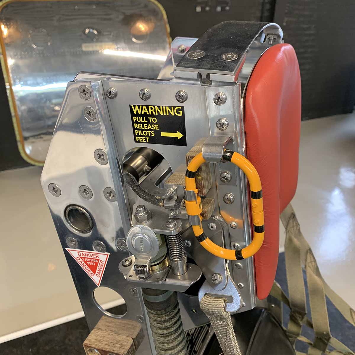 Detail of headrest of a polished Lockheed C2 ejection seat.