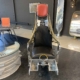 Office chair made of a polished Lockheed C2 ejection seat as displayed in Kaeve.