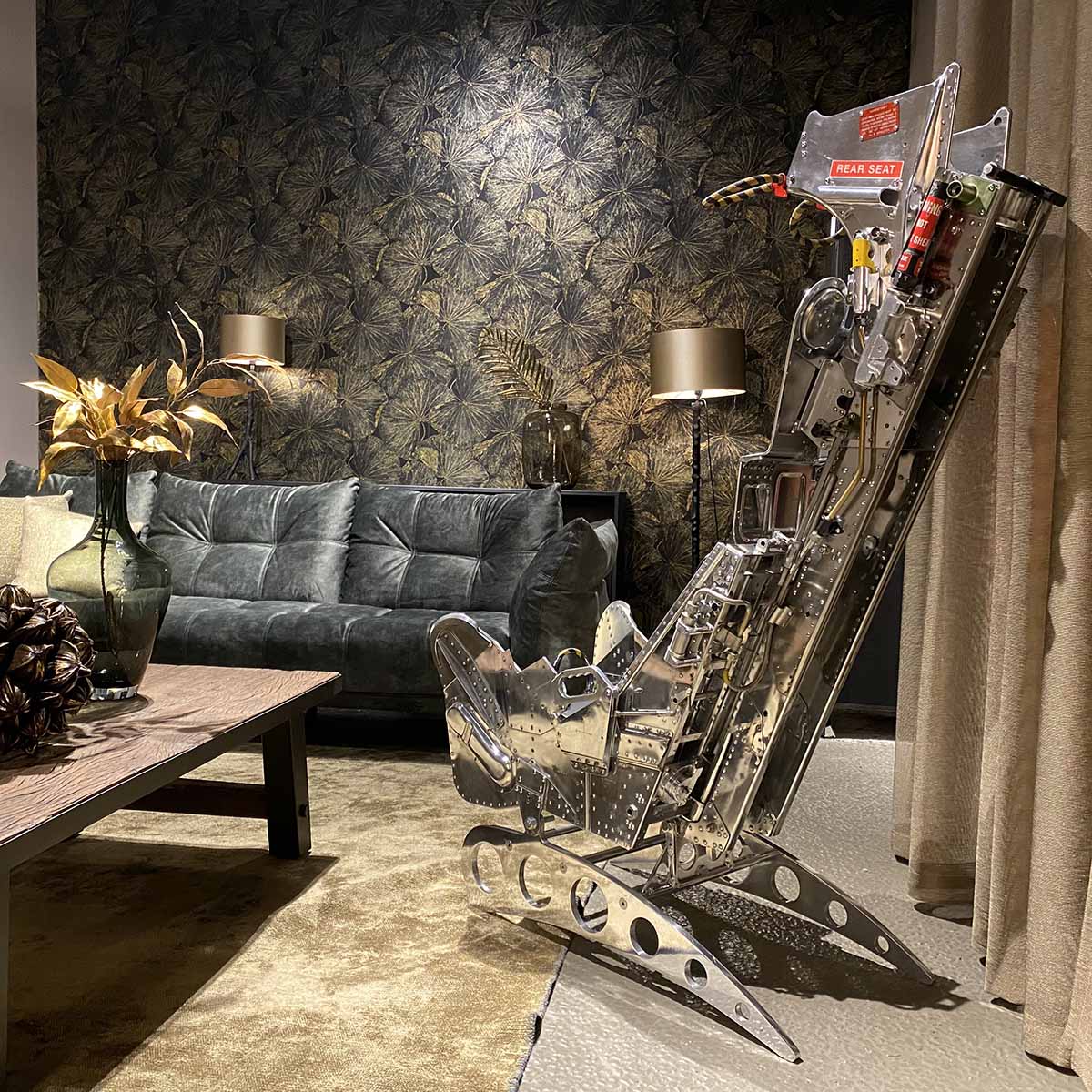 Mirror polished Martin-Baker Mk6 ejection seat in a living room.