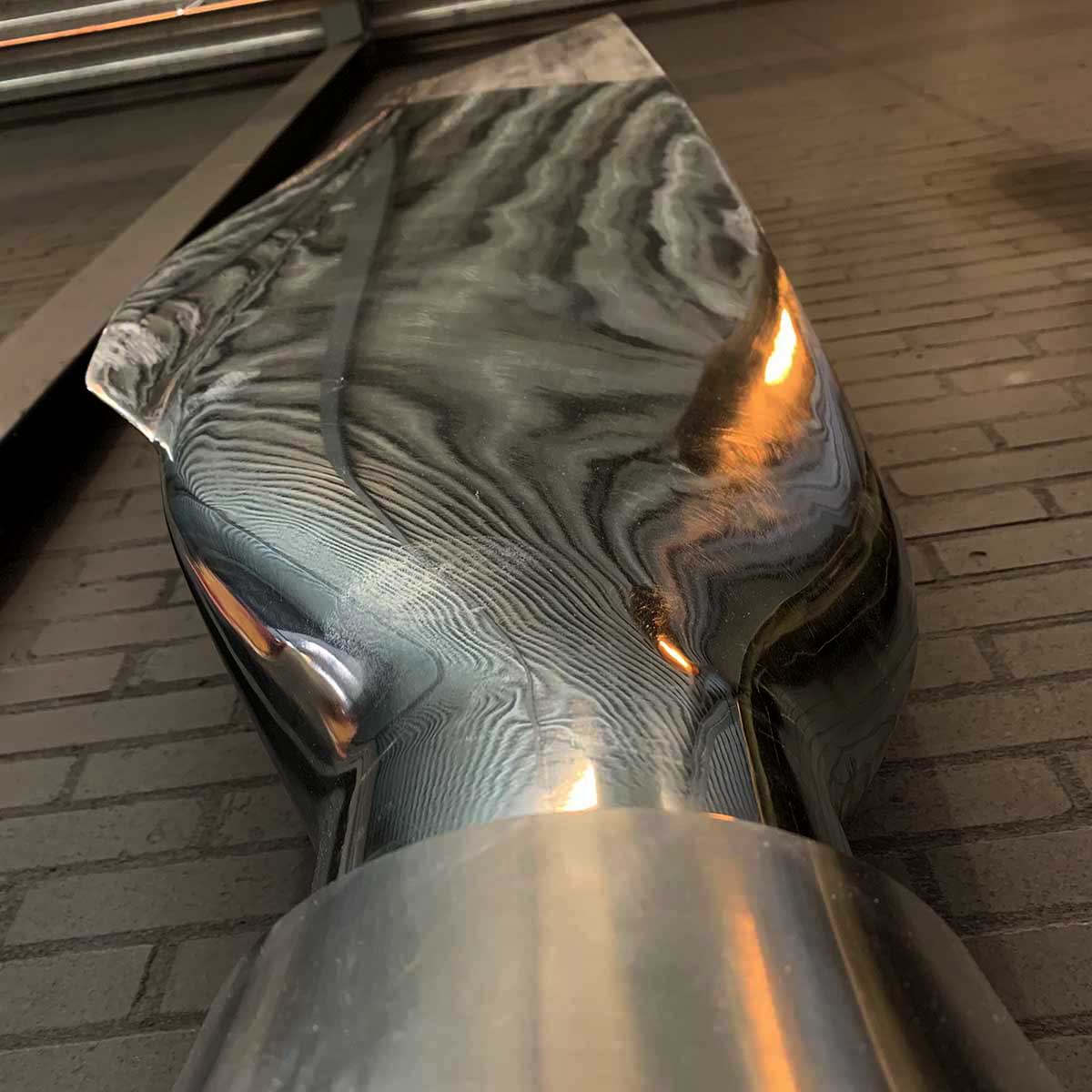 Upward view of polished Lockheed C-130A Hercules propeller blade.