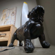 Decorative dog protecting a De Havilland aircraft propeller that was intended for a Handley Page Hastings displayed in a living room.