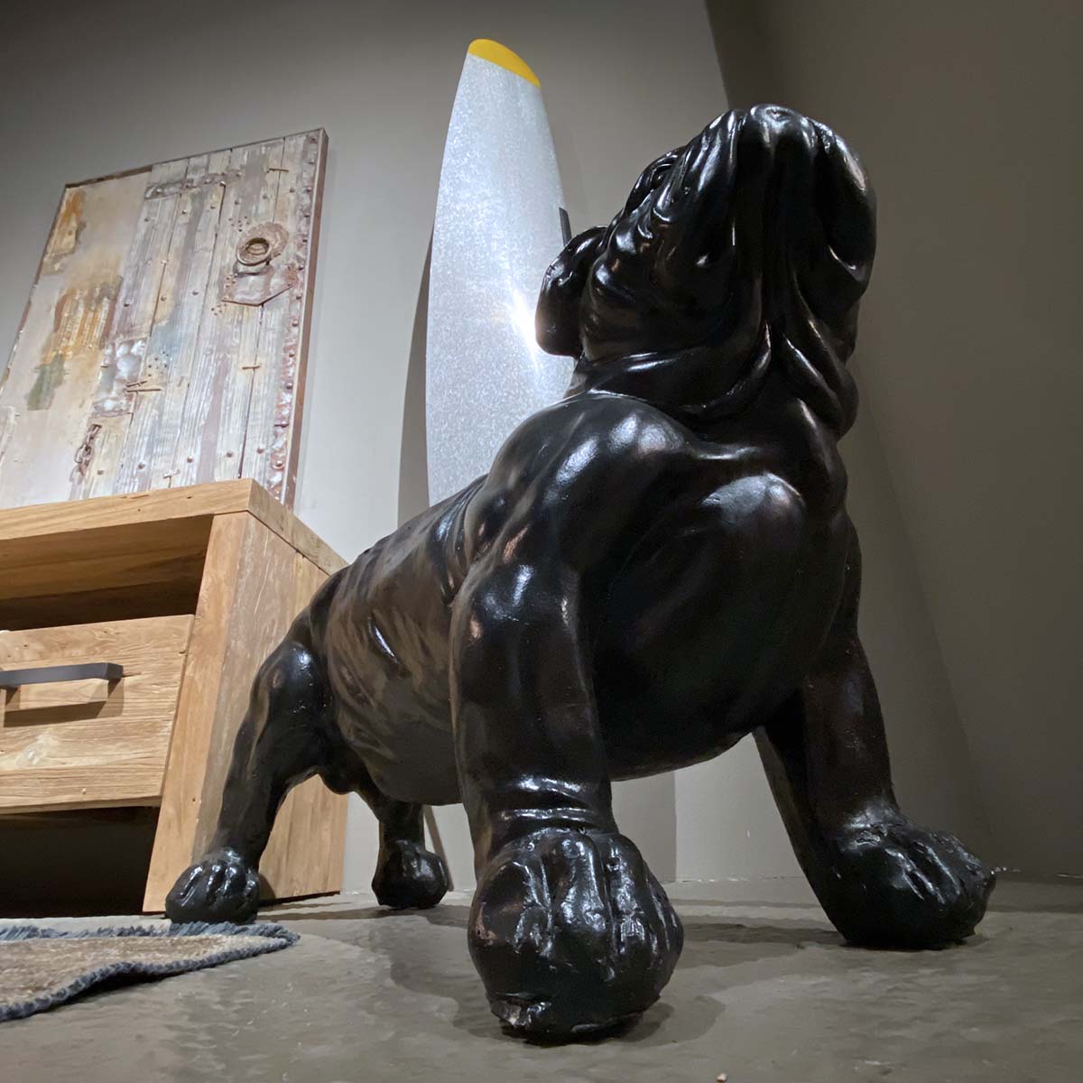 Decorative dog protecting a De Havilland aircraft propeller that was intended for a Handley Page Hastings displayed in a living room.