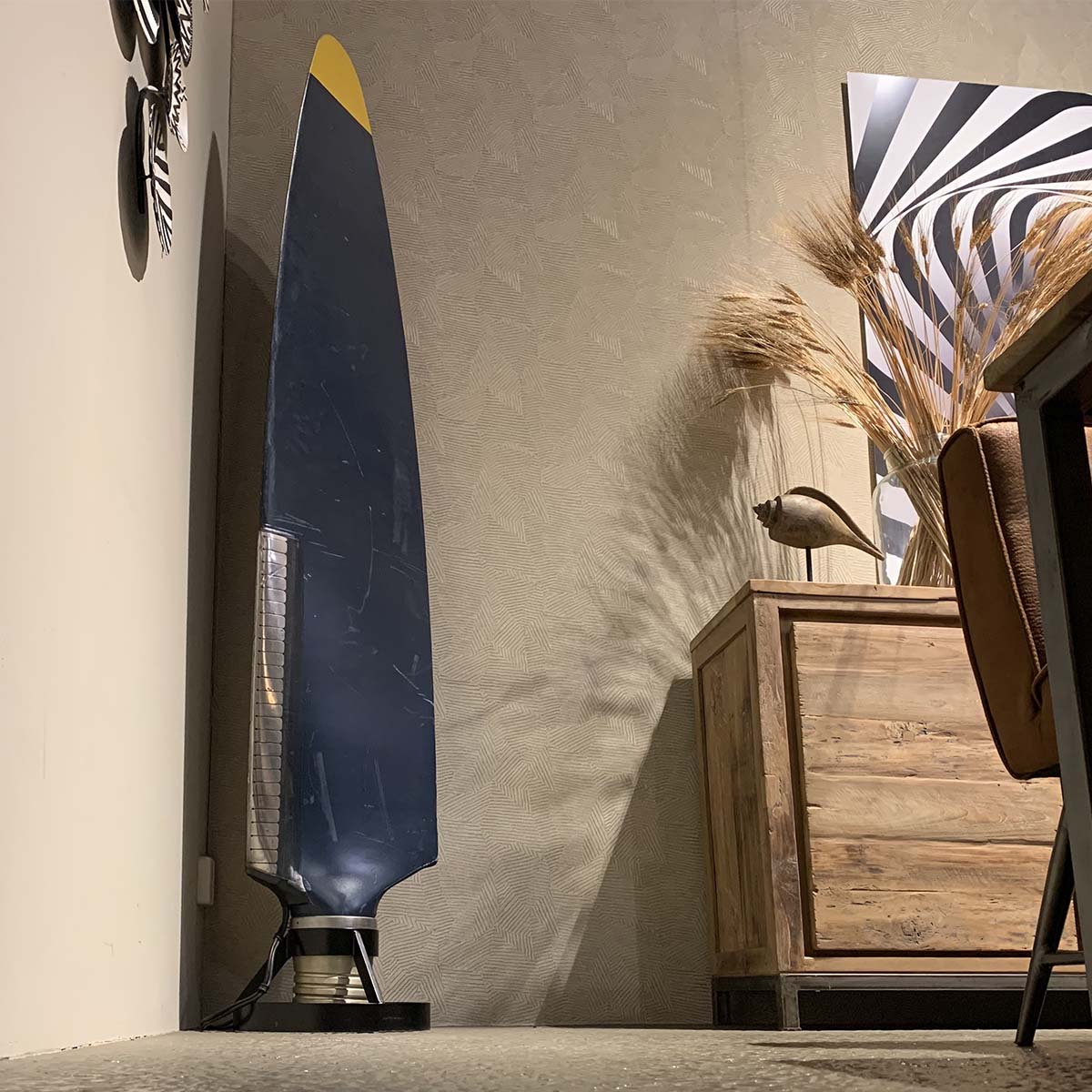 Antonov 24 propeller sitting pretty in a corner of a living room as a decorative piece.