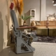 Side view of a cockpit seat from a Fairchild C-119 transport aircraft in a modern living room.