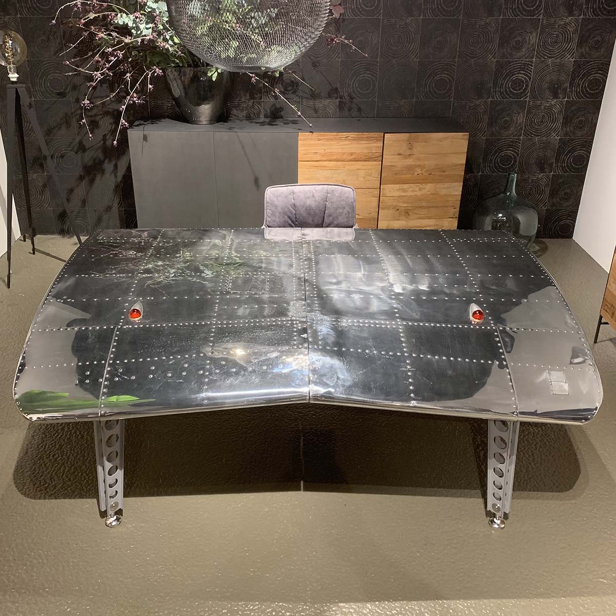Office desk made from two mirror polished Twin Beech aircraft wingtips.