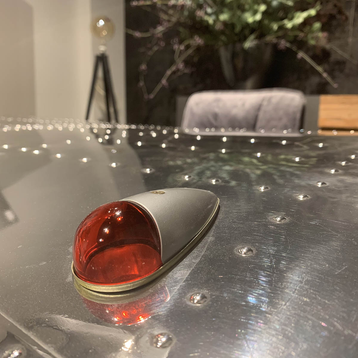 Aircraft position light on an office desk made from two Beech 18 wingtips.