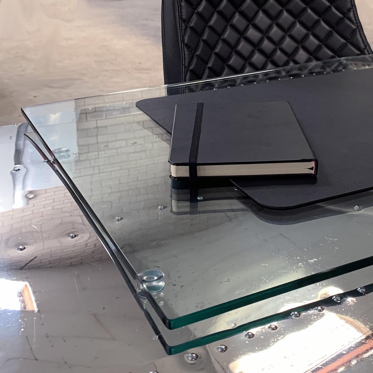 View of a detail of a Beech 18 aircraft wingtip desk, showing the glass plate.