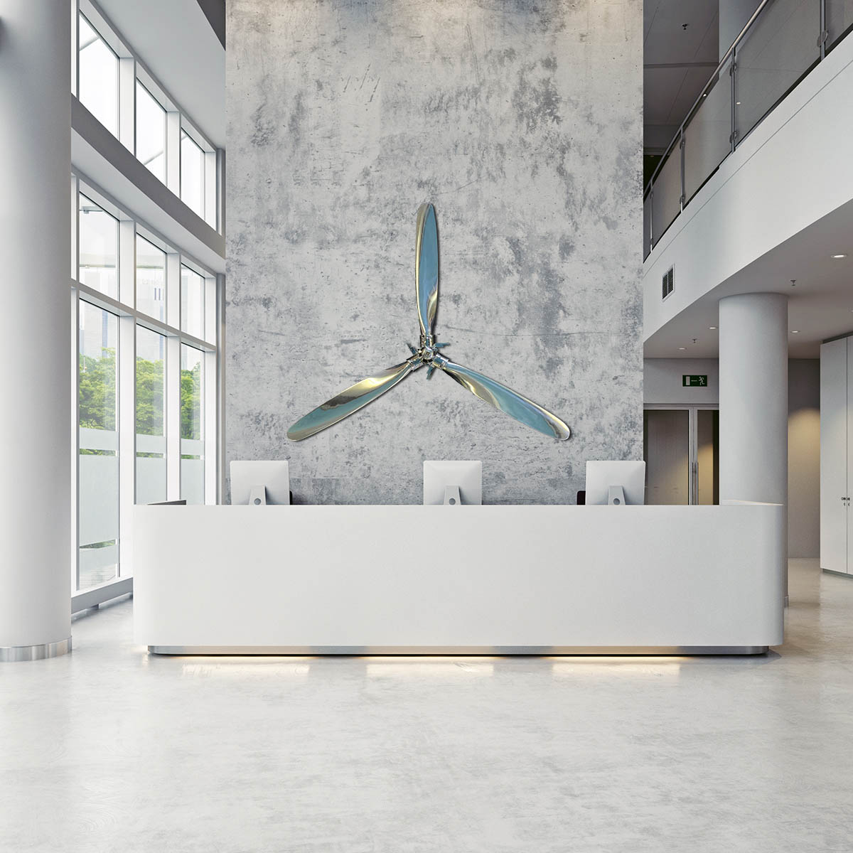 Polished Hartzell propellers and hub displayed in the reception area of an office.