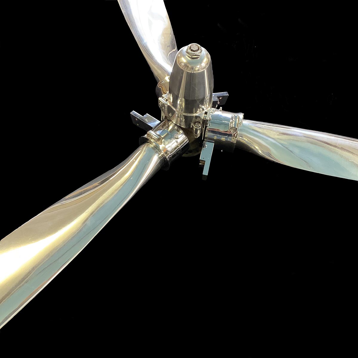 Three-bladed Hartzell propeller and hub that was polished and prepared for display purposes.