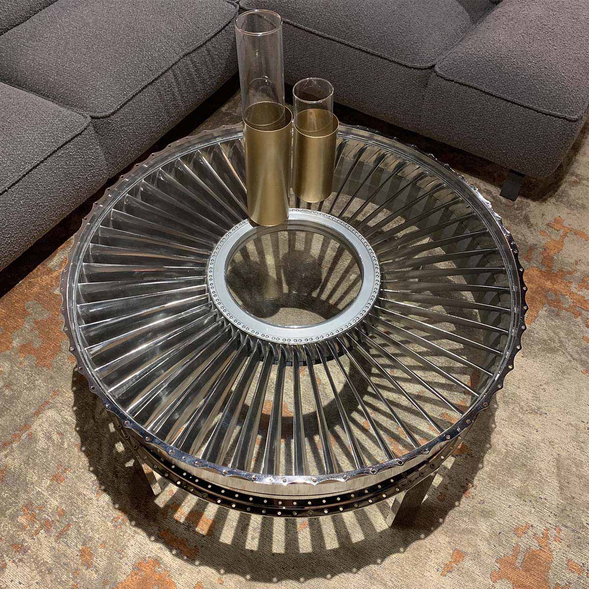 Polished rear fan case of a Pratt & Whitney JT8D turned into a table for sale.