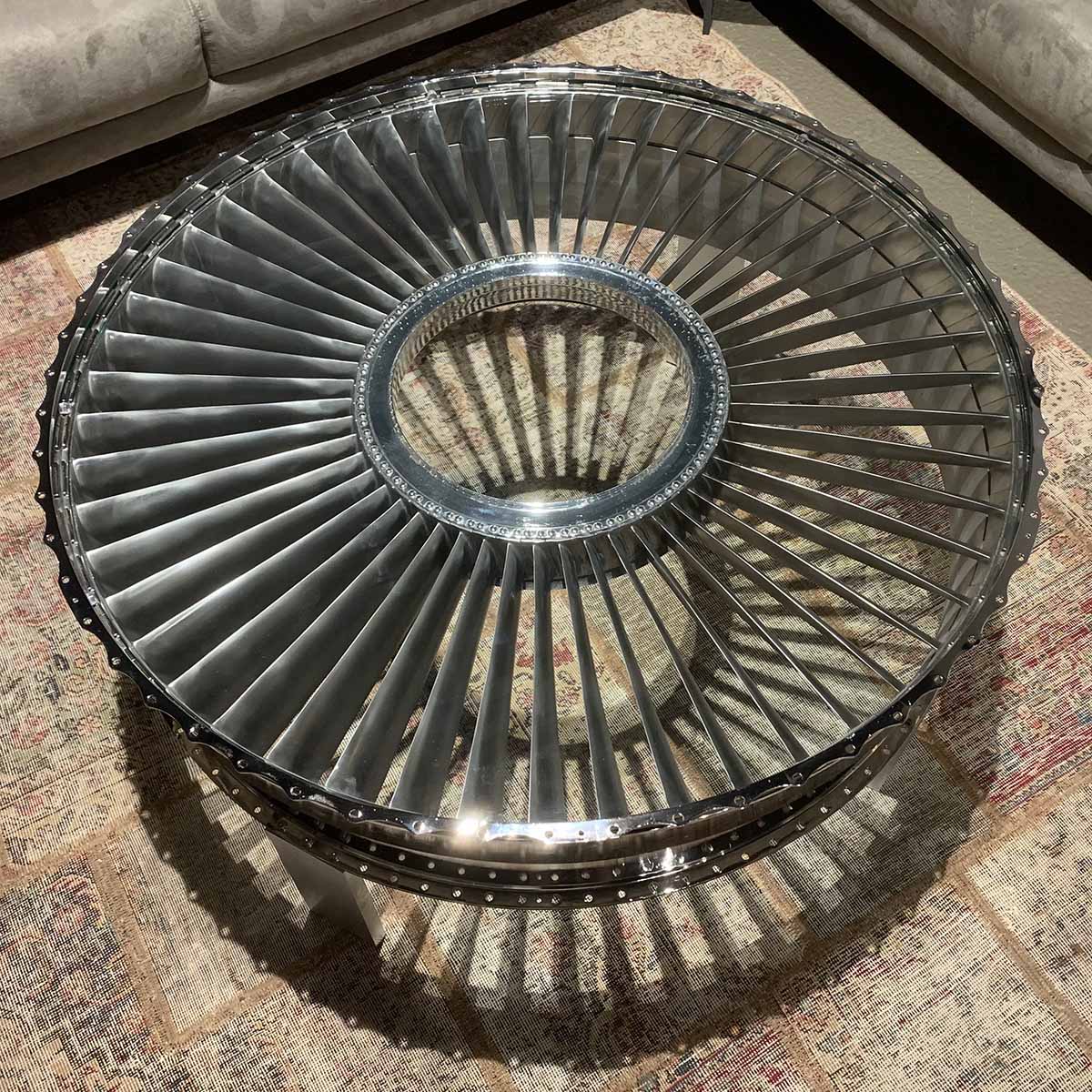 Polished rear fan case of a P&W JT8D turned into a table for sale.