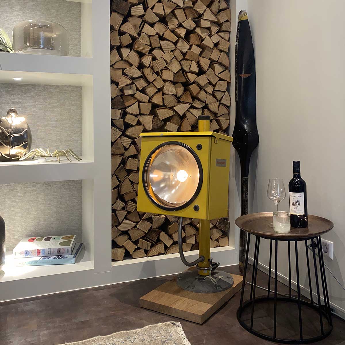 G. Merville propeller type 693B positioned in the corner of a room, next to a Honeywell approach sequence light.