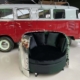 Douglas C-47 Dakota engine cowling love seat in front of a red Volkswagen Transporter T1 van.