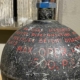 Detail of text on an aircraft hydraulic system accumulator.