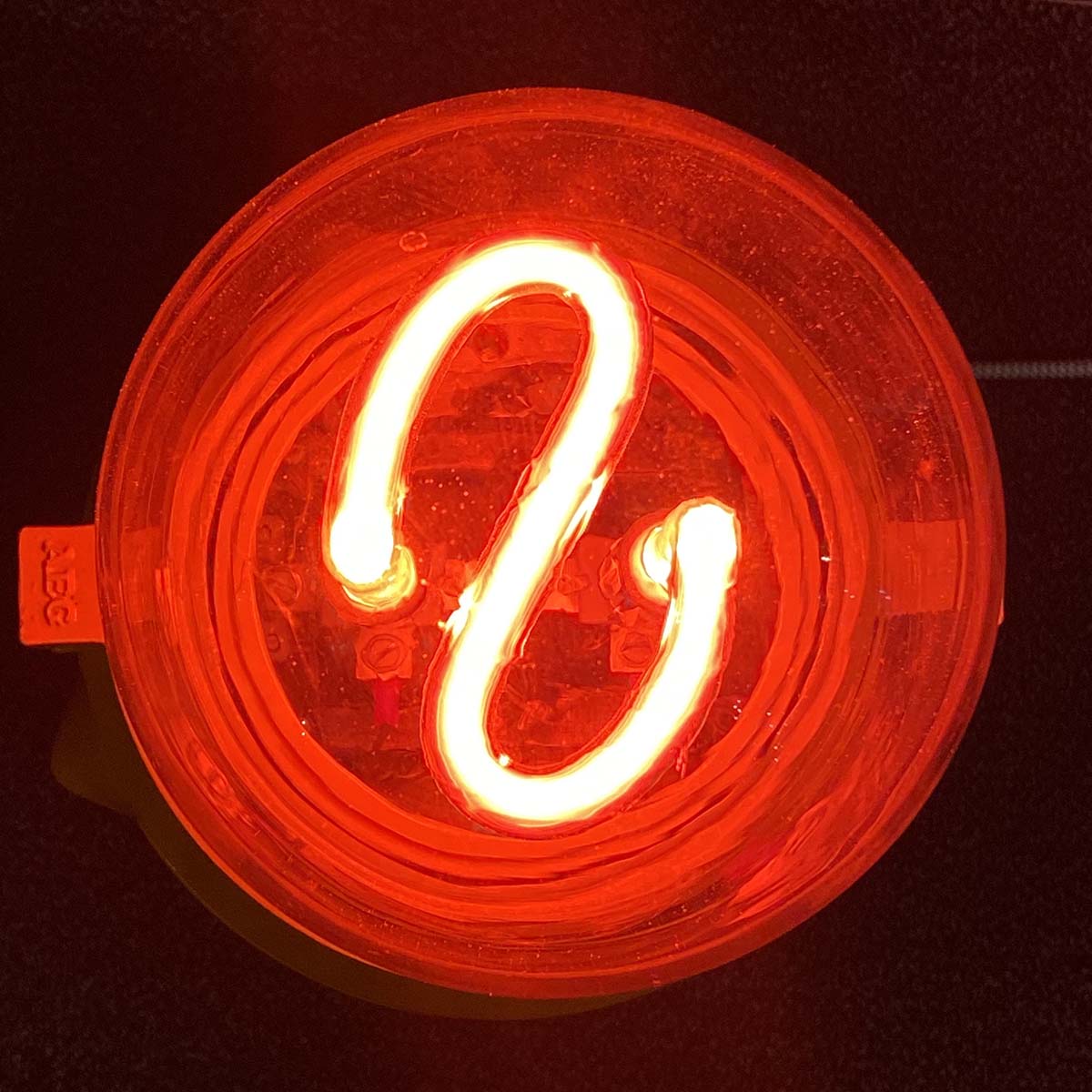 Top view of a neon airport obstruction light.