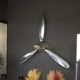 Polished three-bladed Hartzell propeller with spinner in use as a decorative item.