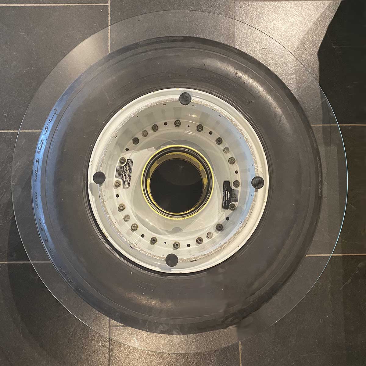 Top view of a coffee table made from the nosewheel of a dismantled Boeing 727.