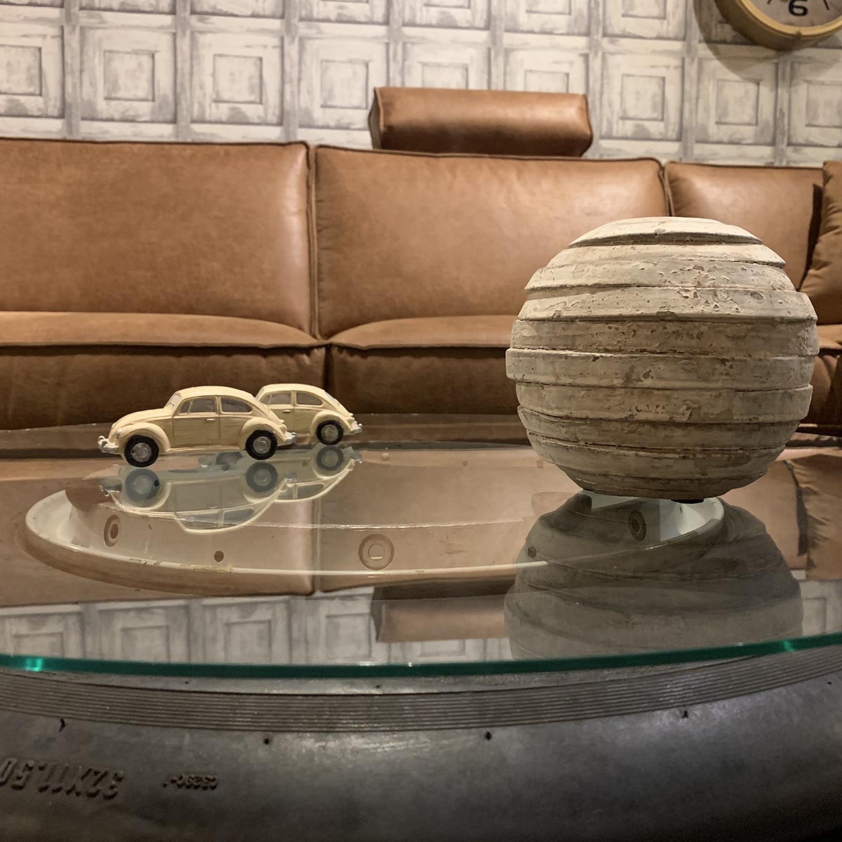 Boeing 727 nosewheel modified to be used as a coffee table in a living room.