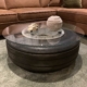 Boeing 727 nosewheel in use as a coffee table in a living room.