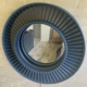 Mirror made from a Pratt & Whitney JT8D engine C2 stator hanging on a bedroom wall.