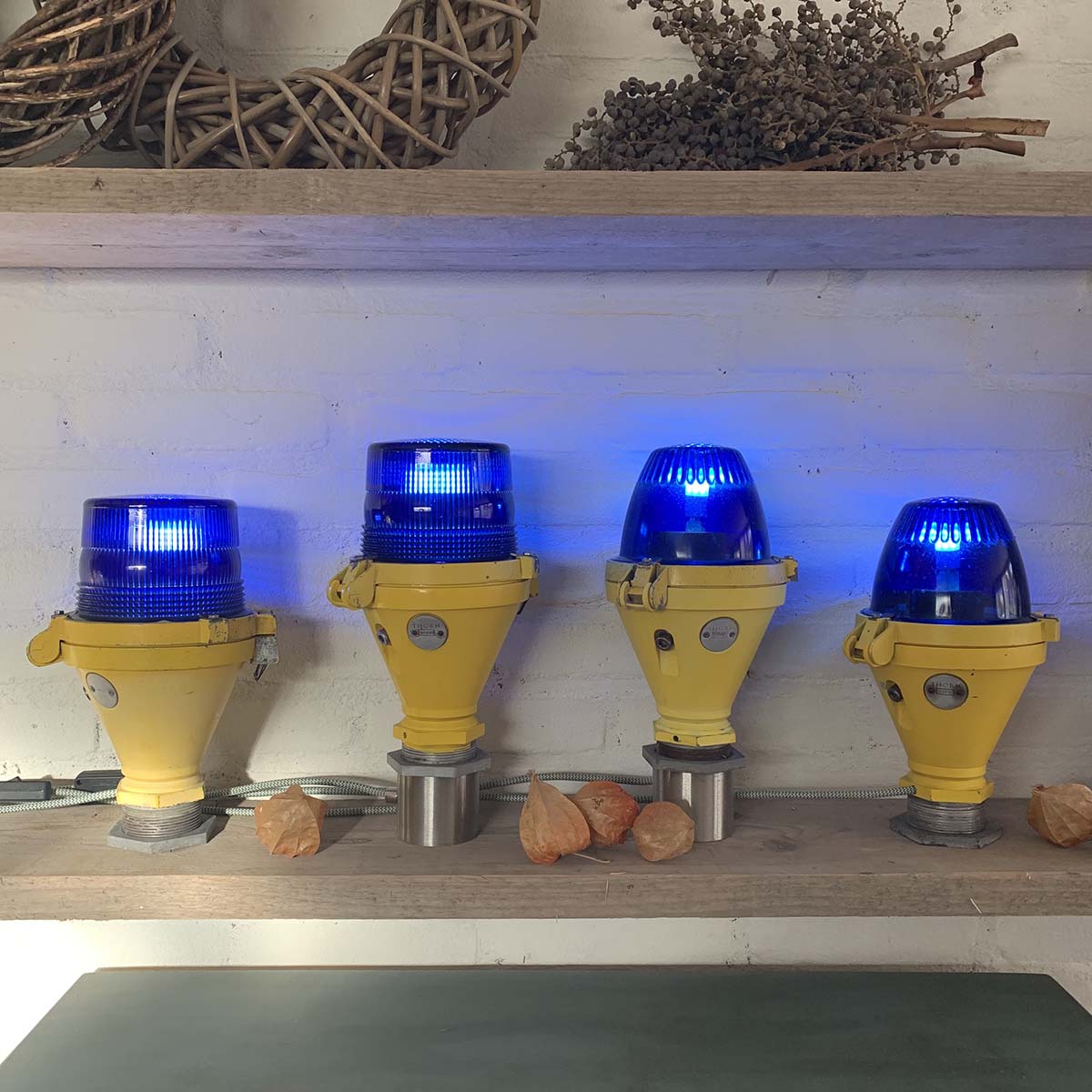 Four refurbished Thorn taxiway lights positioned next to each other to show all versions avialable for sale.