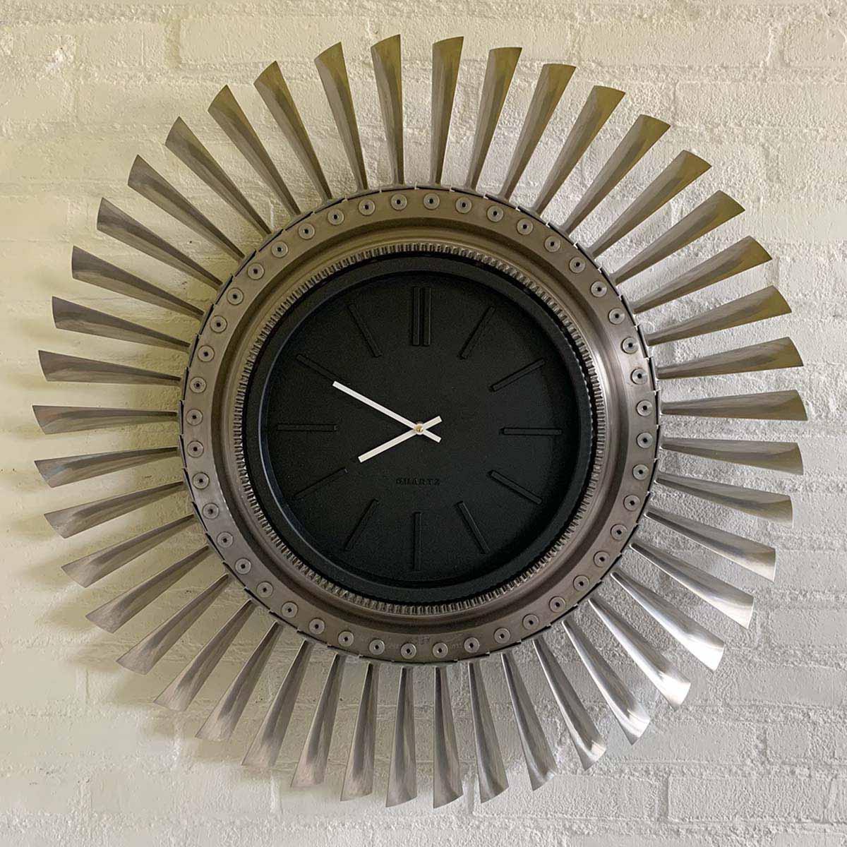 Clock made from parts of the engine of a Su-22 Fitter aircraft for sale.