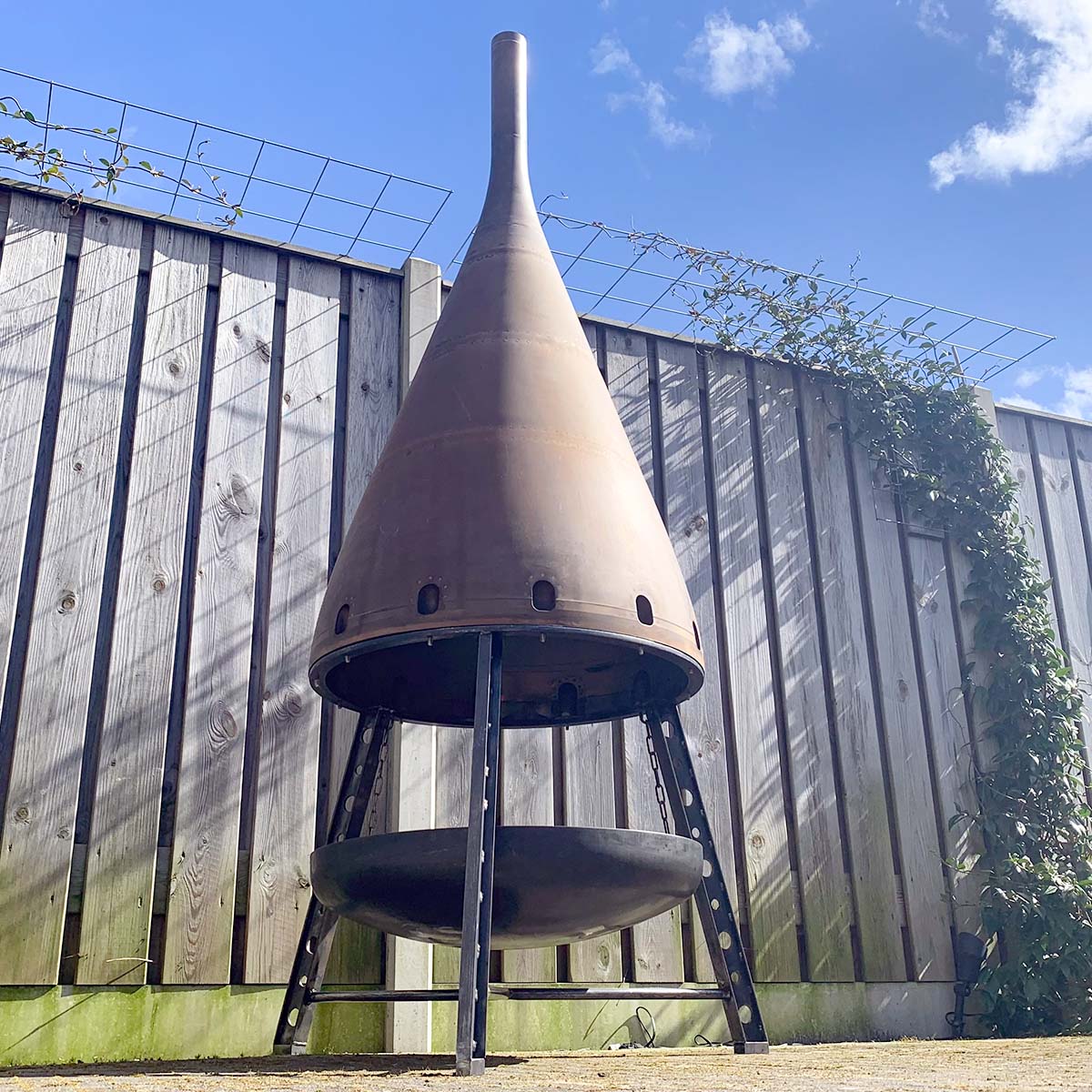Outdoor fireplace made from an exhaust cone of a Kuwait Airways Boeing 747.