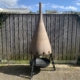 Large outdoor fireplace that was made using the exhaust cone of a Boeing 747 engine.